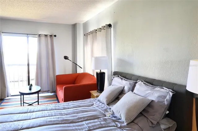 a kitchen with a sink dishwasher a stove and a microwave oven with cabinets