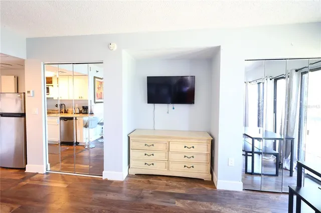 a kitchen with a refrigerator and a sink