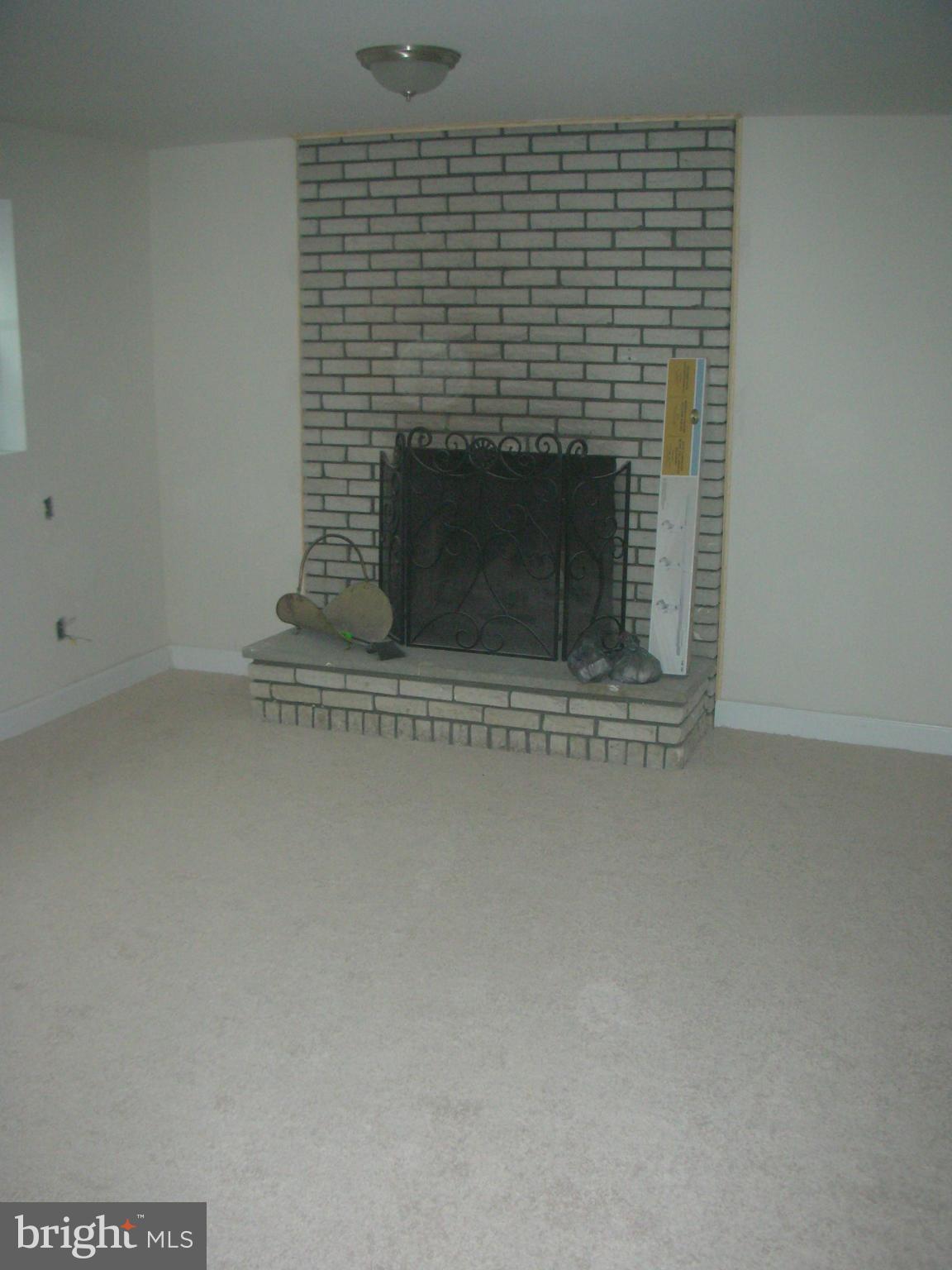12915 Glynis Road Clinton, MD 20735 - Photo 20 of 29 Basement Fire Place