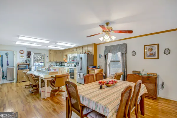 a view of a dining room with furniture and wooden floor