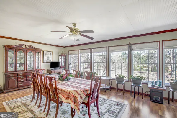 a view of a dining room with furniture window and outside view