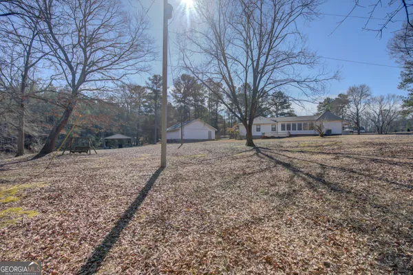 a view of empty yard with trees