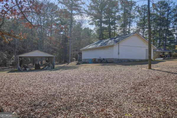 a house with trees in the background