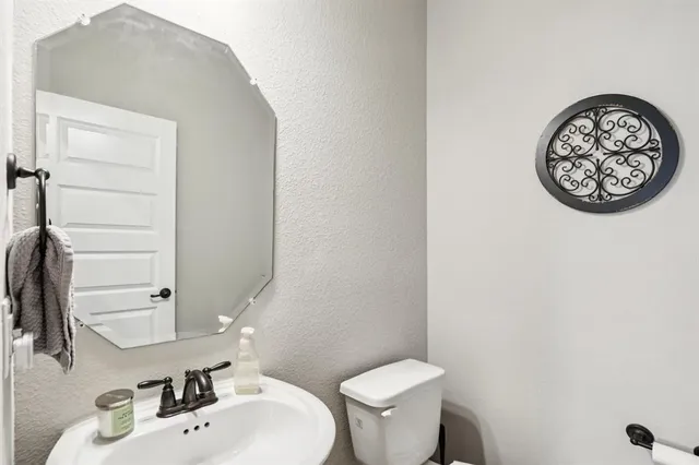 a bathroom with a toilet and a sink