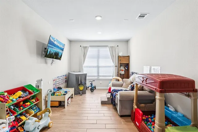 a bedroom with furniture and a window