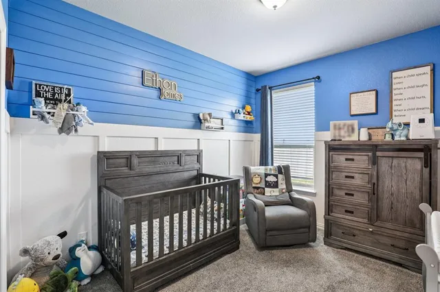 a bedroom with a bed and a furniture