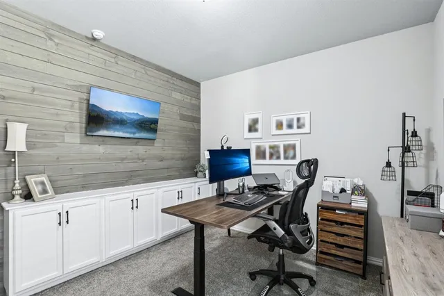 a view of a workspace with furniture