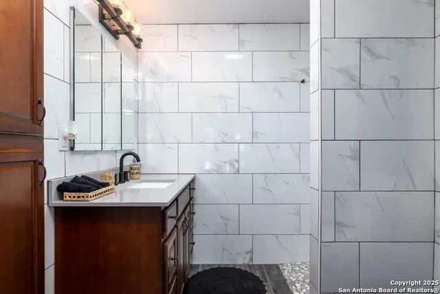 a bathroom with a sink and a window