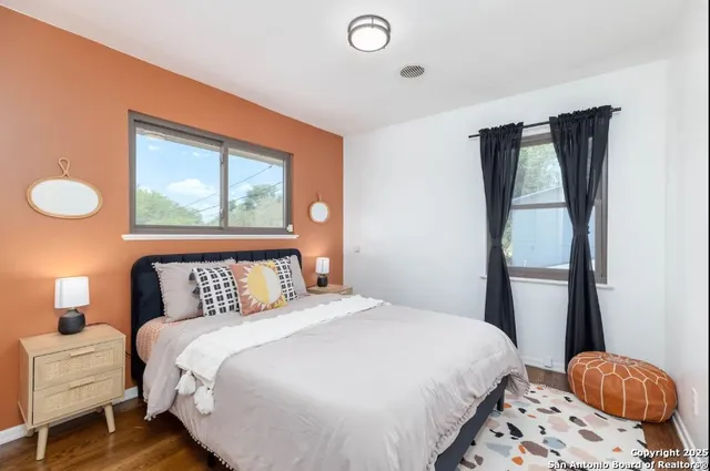 a bedroom with a bed and window