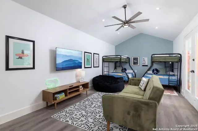 a living room with furniture and a rug