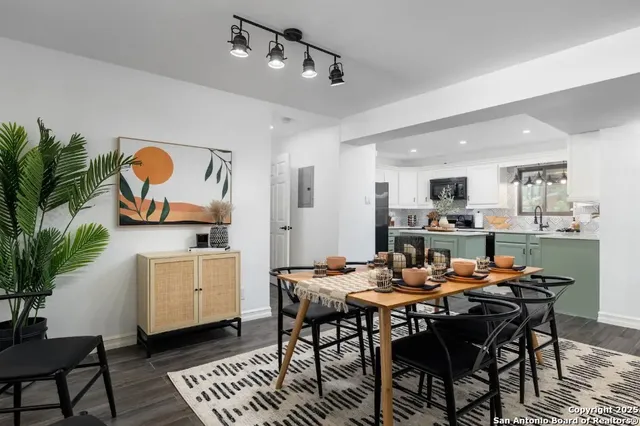 a dining room with furniture and window