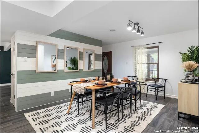 a view of a dining room with furniture window and wooden floor