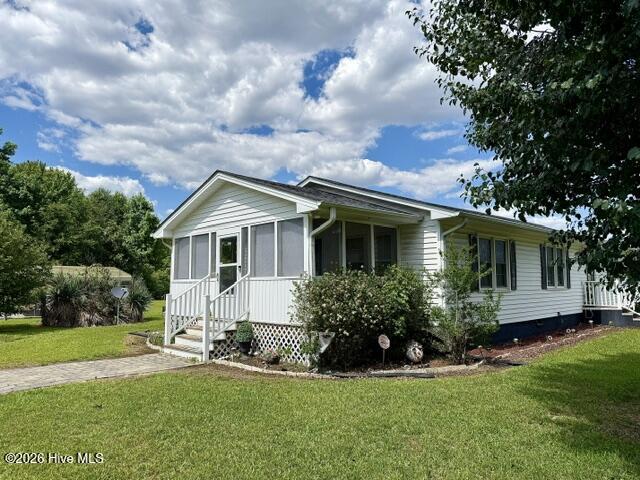396 Ronnie Road Autryville, NC 28318 - Photo 2 of 43 Screened porch with 2 plus acres