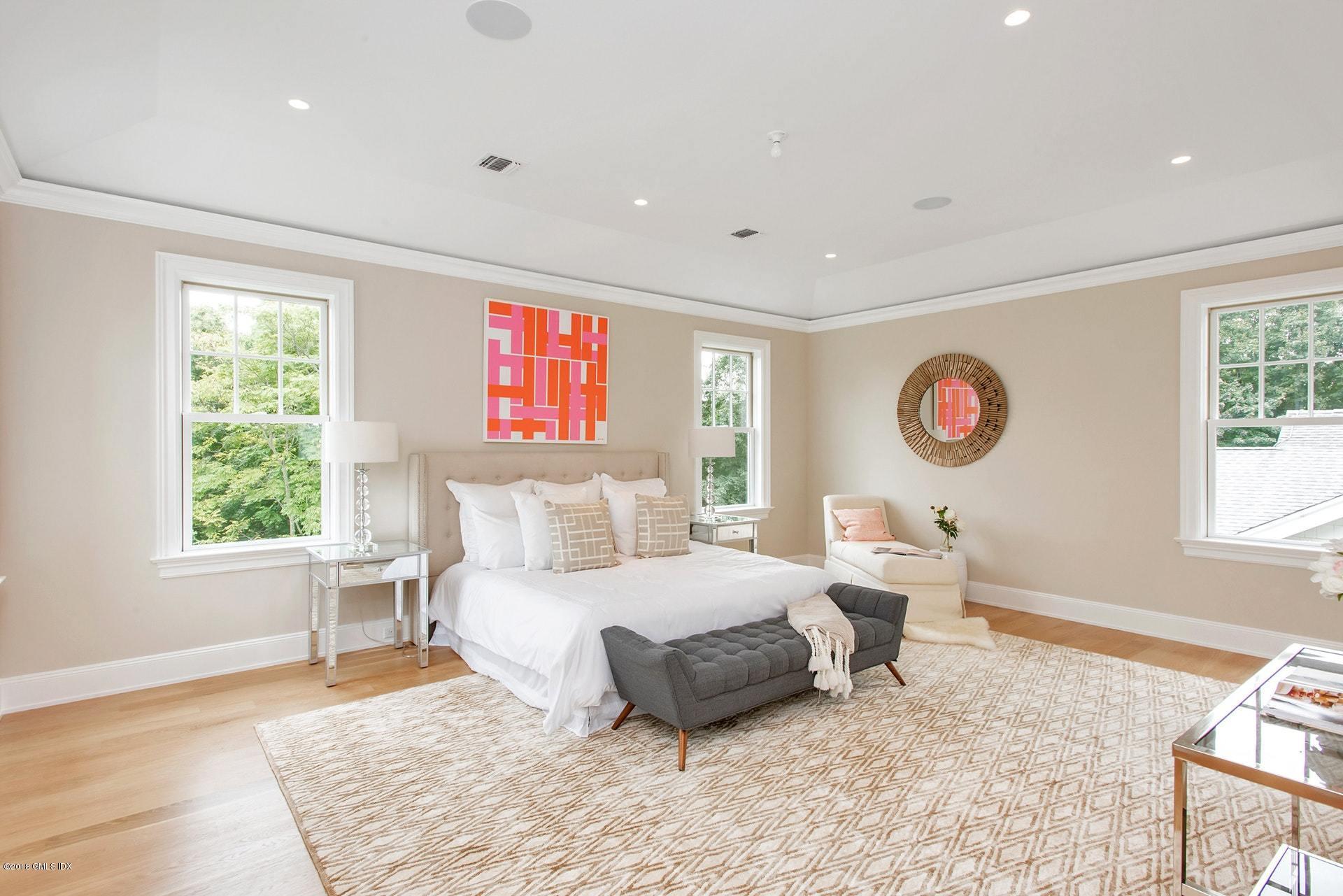 51 Sheep Hill Road Riverside, CT 06878 - Photo 17 of 36 a bedroom with a bed and a window