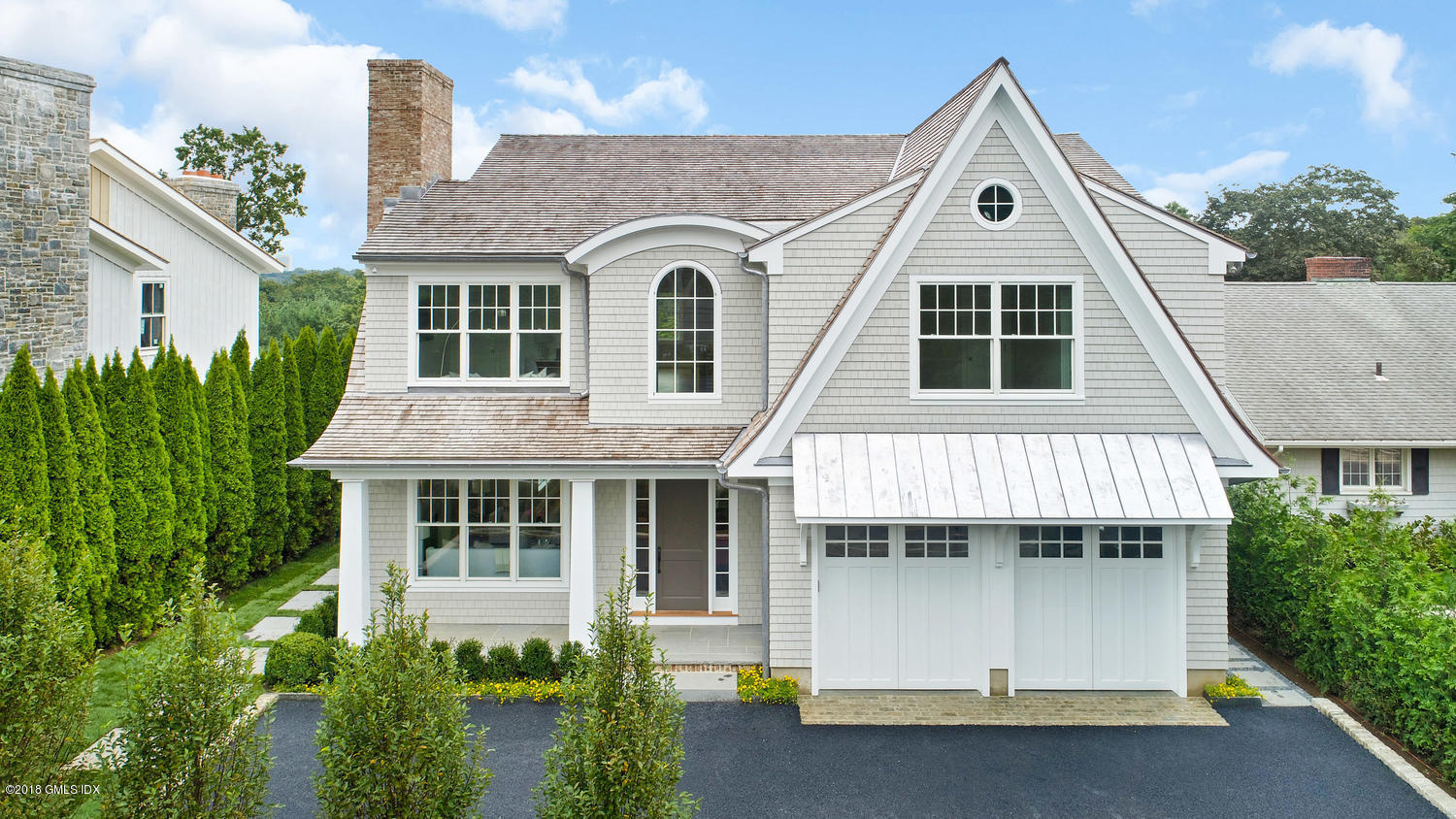 51 Sheep Hill Road Riverside, CT 06878 - Photo 2 of 36 a front view of a house with a yard