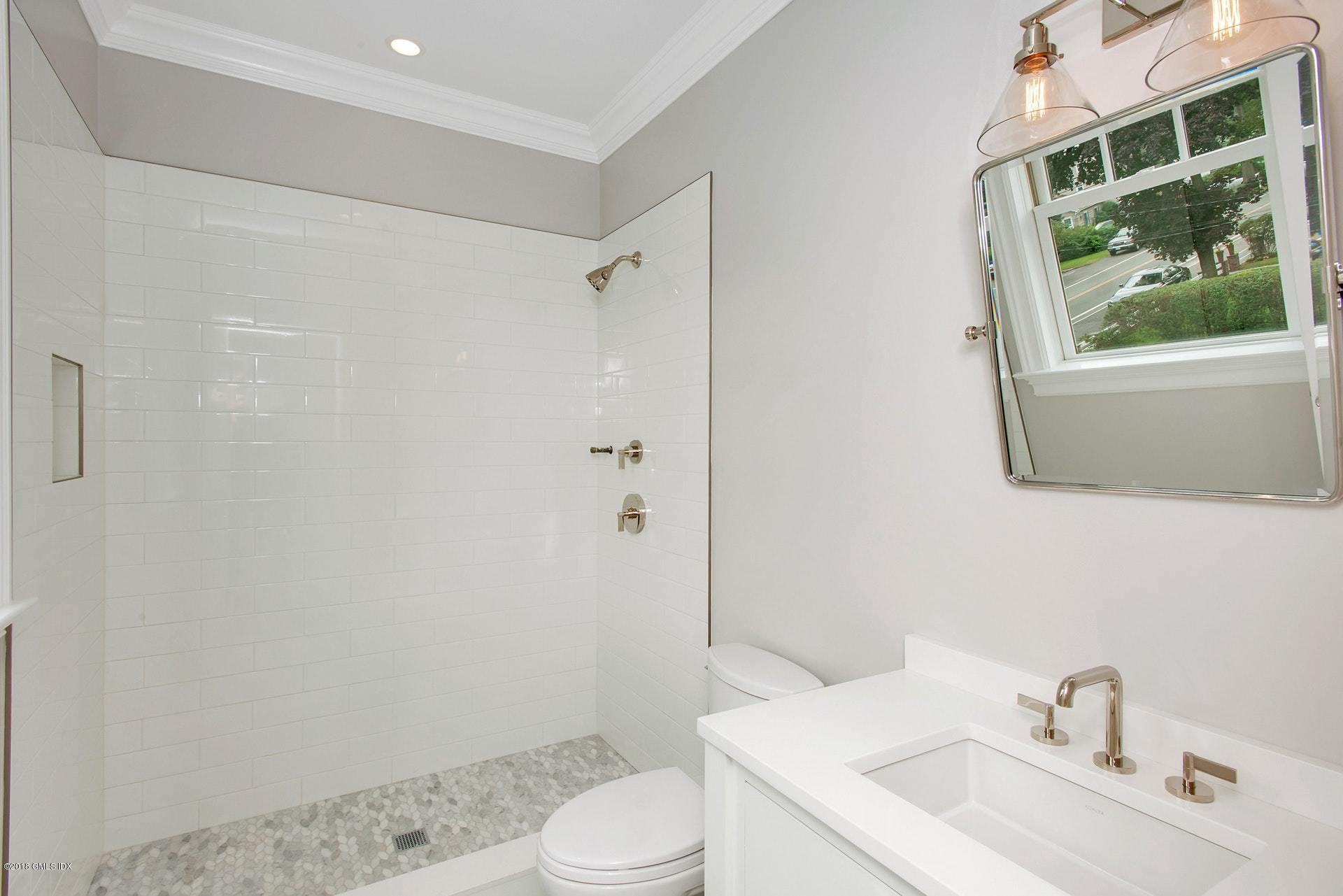 51 Sheep Hill Road Riverside, CT 06878 - Photo 25 of 36 a bathroom with a sink toilet and tub