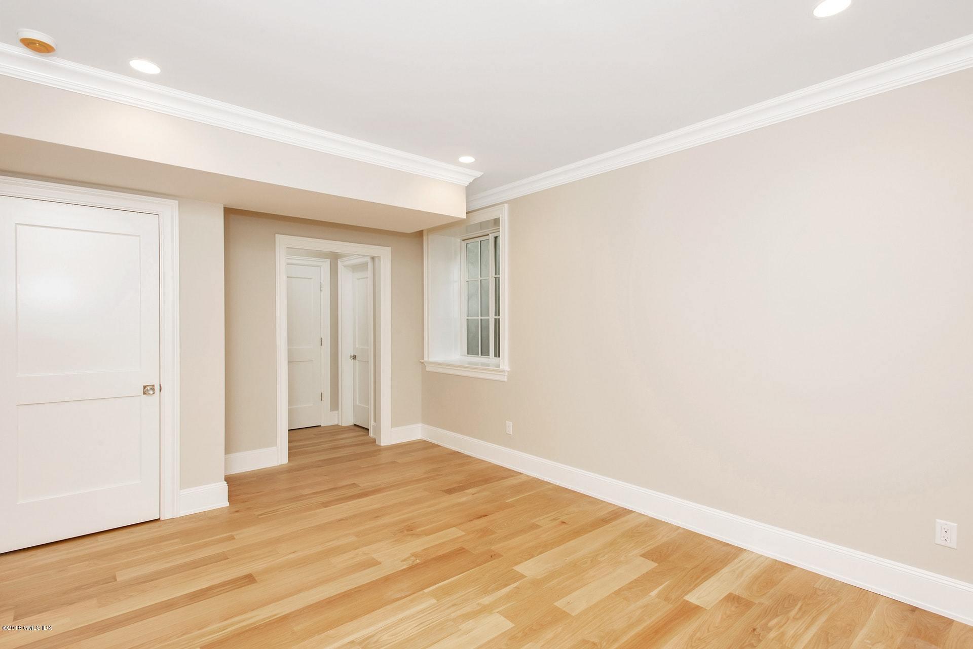 51 Sheep Hill Road Riverside, CT 06878 - Photo 28 of 36 a view of a room with wooden floor and white walls
