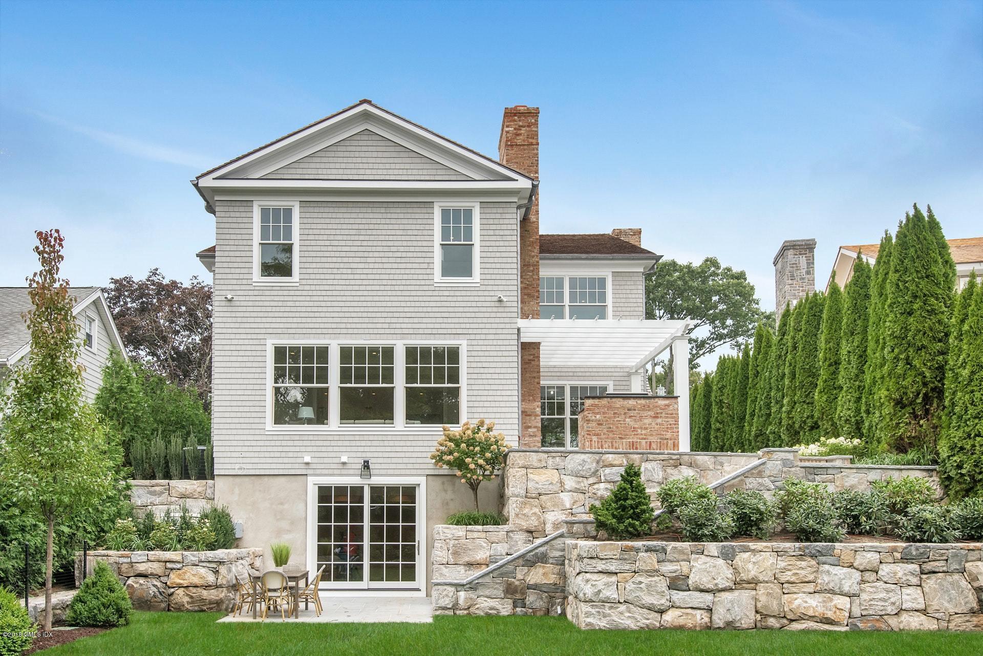 51 Sheep Hill Road Riverside, CT 06878 - Photo 30 of 36 a front view of a house with a yard