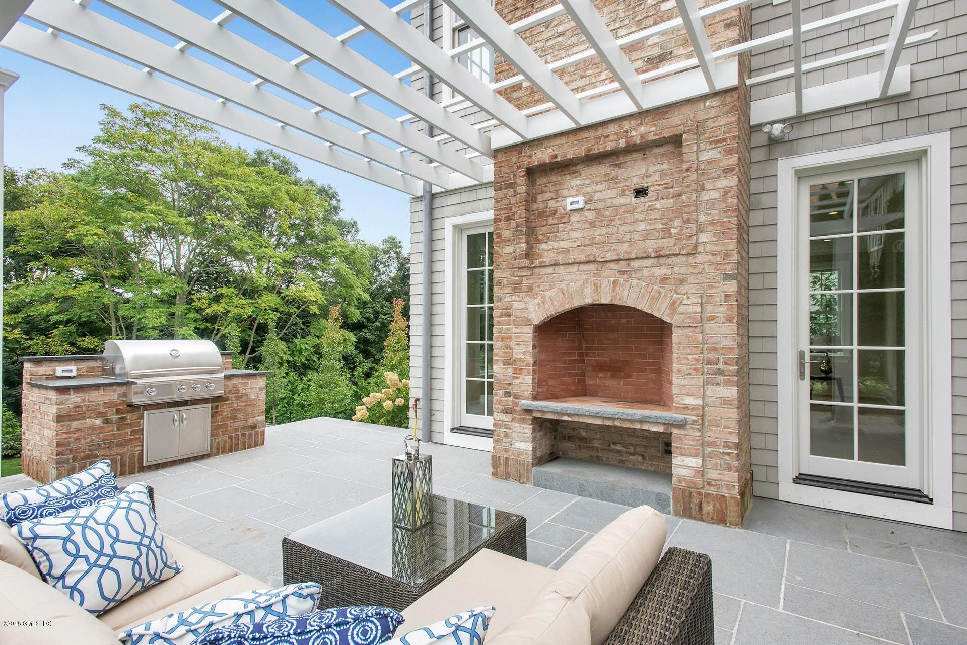 51 Sheep Hill Road Riverside, CT 06878 - Photo 31 of 36 a living room with furniture and a fireplace