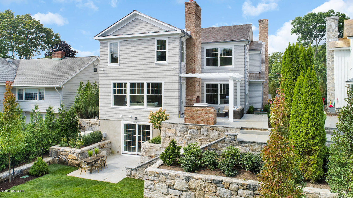 51 Sheep Hill Road Riverside, CT 06878 - Photo 35 of 36 a house view with a garden space