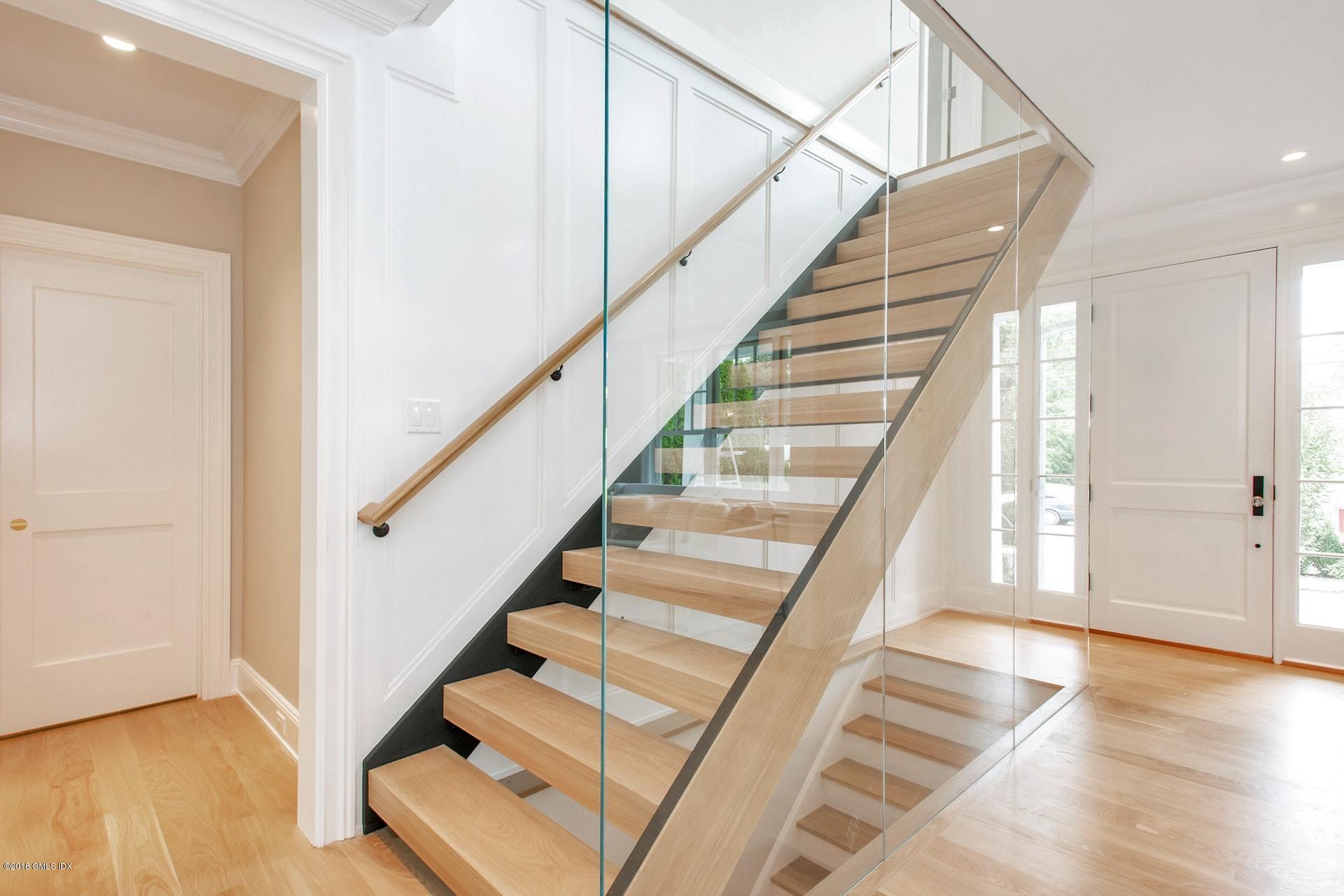 51 Sheep Hill Road Riverside, CT 06878 - Photo 4 of 36 a view of entryway with wooden floor and stairs