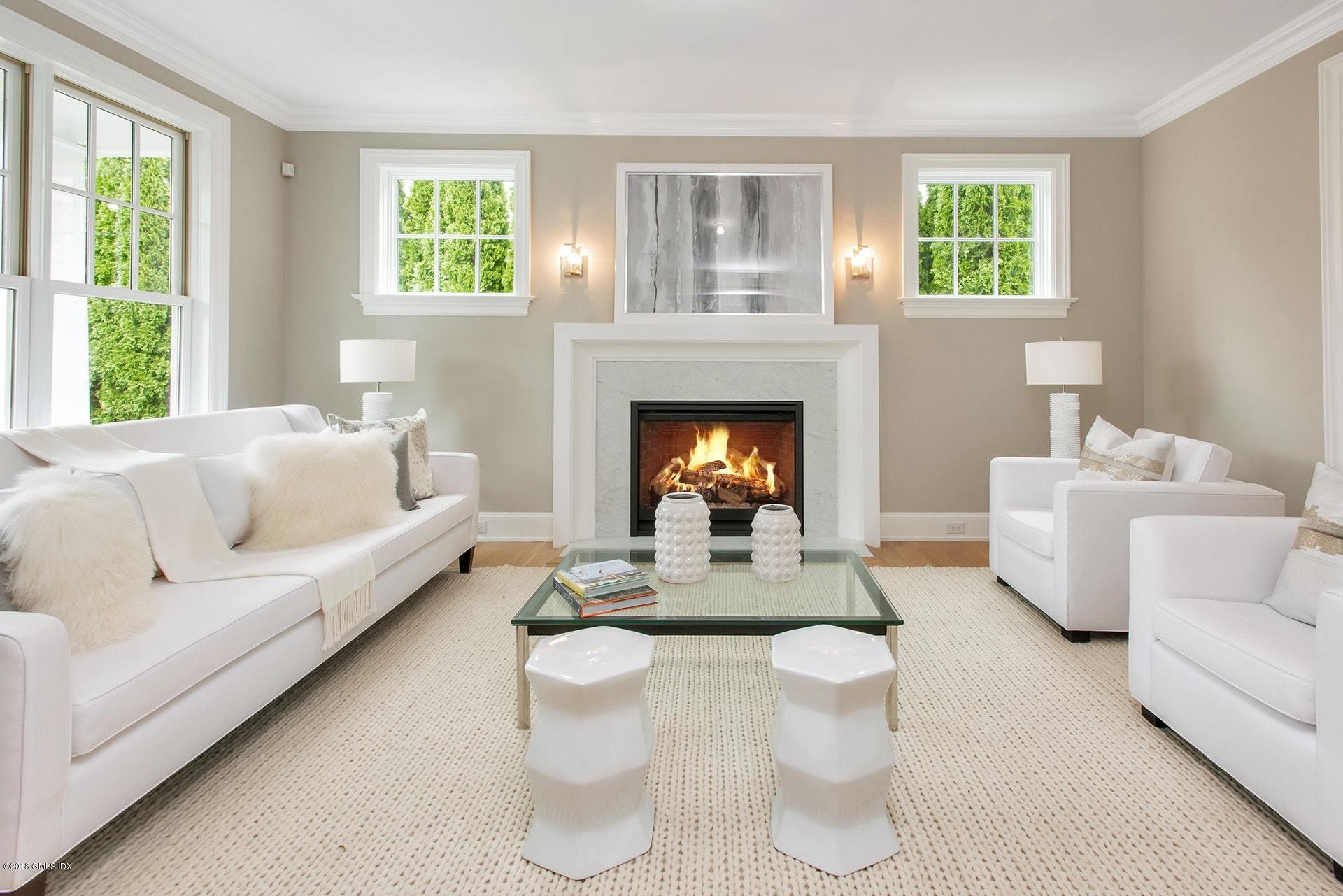 51 Sheep Hill Road Riverside, CT 06878 - Photo 6 of 36 a living room with furniture and a fireplace