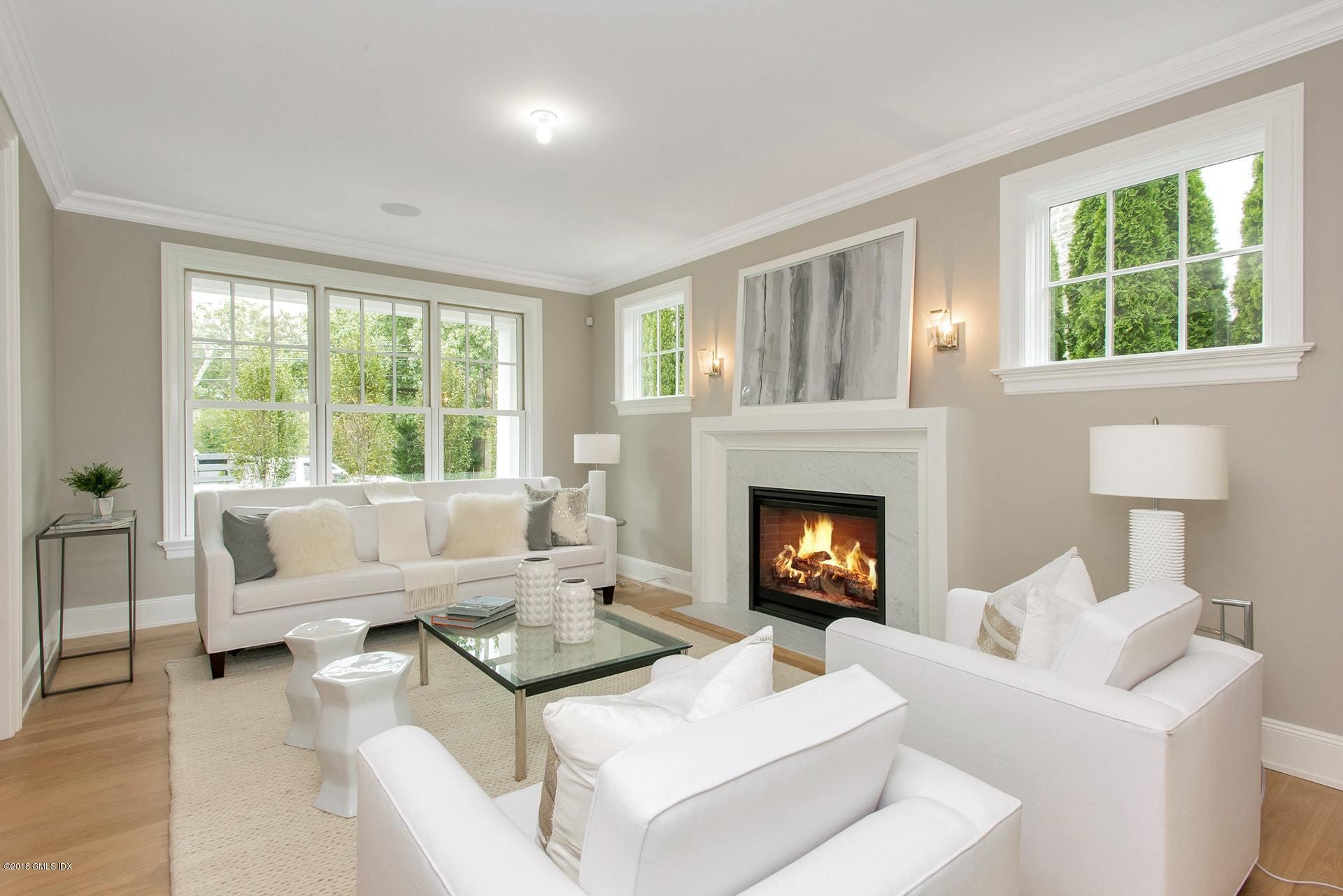 51 Sheep Hill Road Riverside, CT 06878 - Photo 7 of 36 a living room with furniture and a fireplace