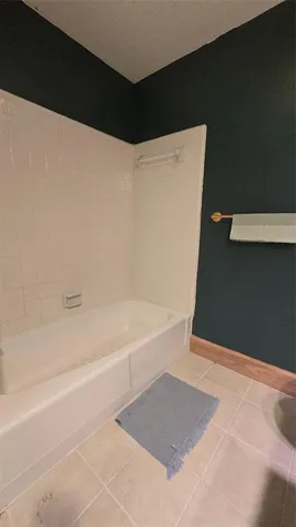 a bedroom with a bed and a table in it