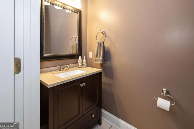 a kitchen with stainless steel appliances granite countertop a sink and cabinets