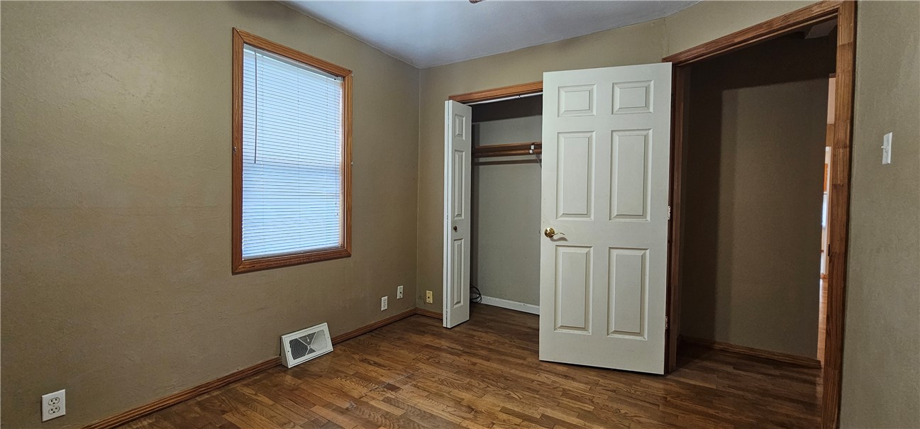 206 East Fifth Street St. Peter, IL 62880 - Photo 13 of 23 an empty room with wooden floor closet and windows