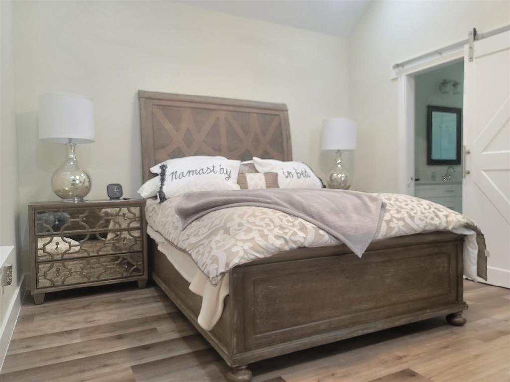 4825 Wichita Street Granbury, TX 76048 - Photo 19 of 30 a bedroom with a bed and window