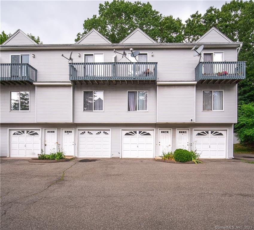 31 Meloy Road, Unit 1C West Haven, CT 06516 - Photo 1 of 1 a front view of a house with a yard and garage