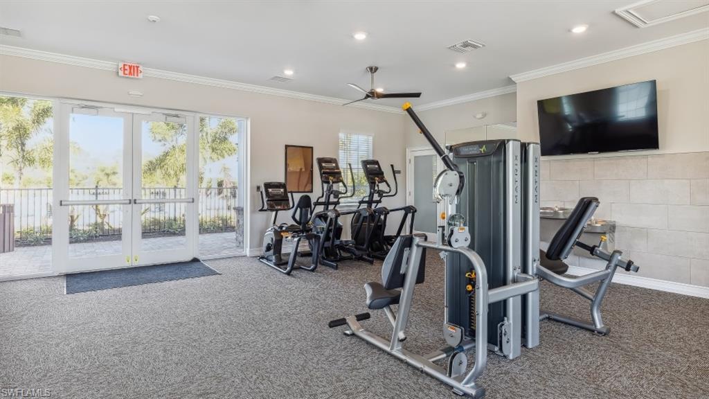 8052 Cedar Ky Way Lehigh Acres, FL 33971 - Photo 33 of 45 The property offers a fitness area featuring various exercise machines, recessed lighting, and a ceiling fan