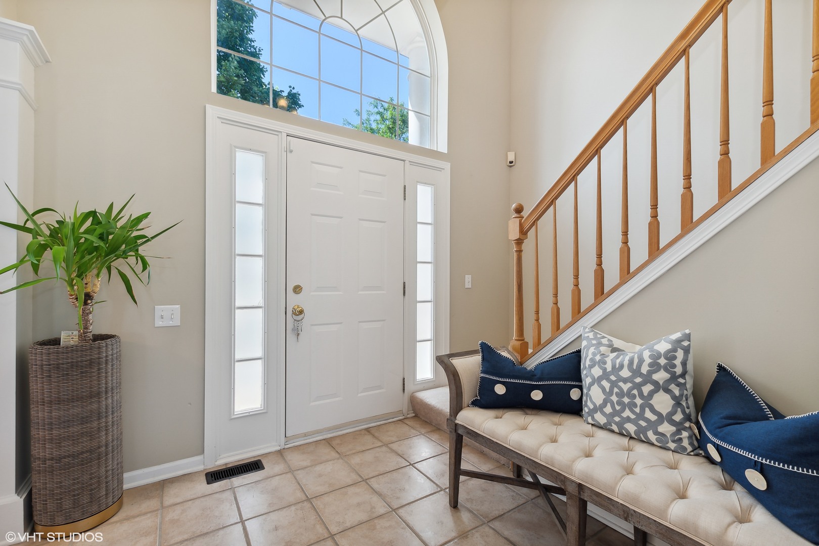 1769 Delta Drive Aurora, IL 60503 - Photo 2 of 14 a view of entryway with wooden floor and stairs