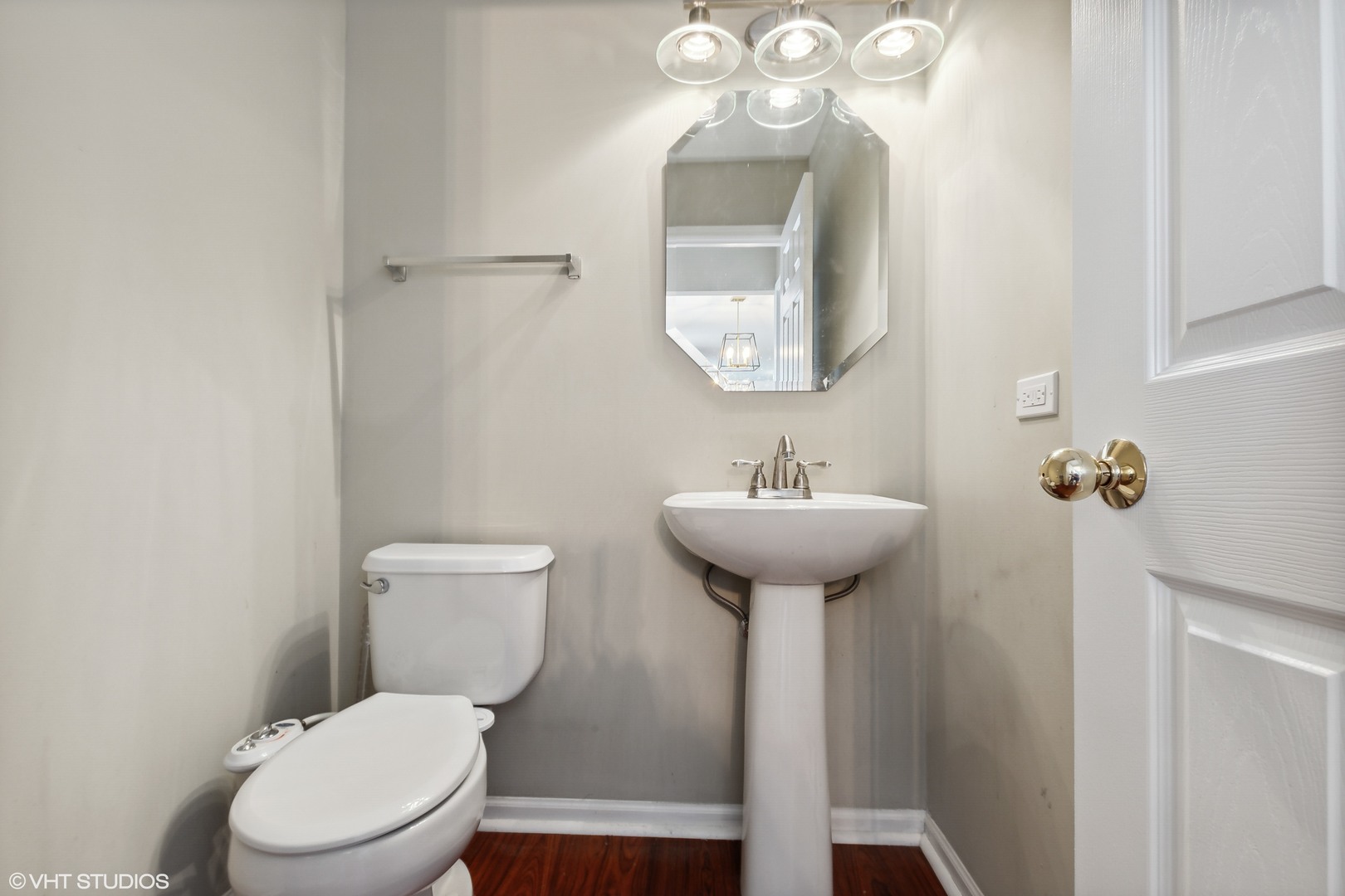 1769 Delta Drive Aurora, IL 60503 - Photo 7 of 14 a bathroom with a toilet sink and mirror