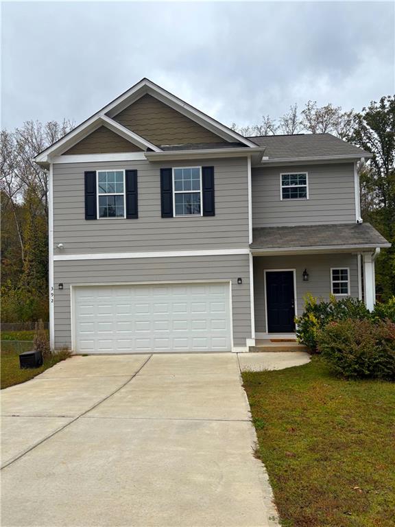 392 Katie Lane Commerce, GA 30529 - Photo 1 of 58 a front view of a house with garden