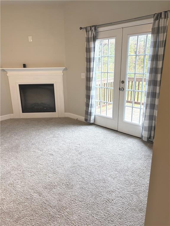 392 Katie Lane Commerce, GA 30529 - Photo 11 of 58 a view of empty room with a fireplace