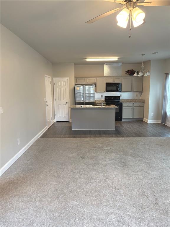 392 Katie Lane Commerce, GA 30529 - Photo 15 of 58 a large kitchen with a large counter top appliances and cabinets