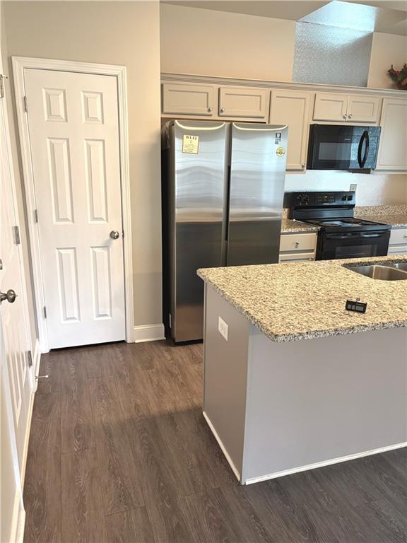 392 Katie Lane Commerce, GA 30529 - Photo 16 of 58 a kitchen with stainless steel appliances a refrigerator and a stove top oven