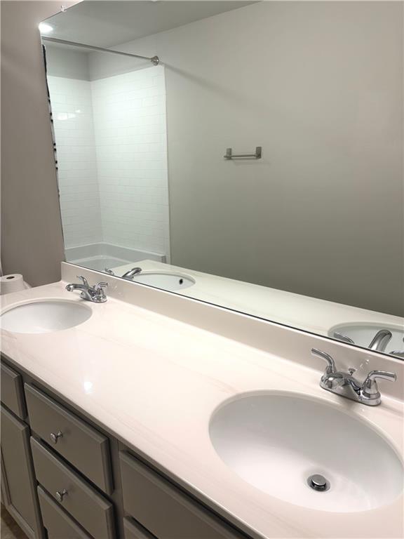 392 Katie Lane Commerce, GA 30529 - Photo 48 of 58 a bathroom with a sink and a mirror