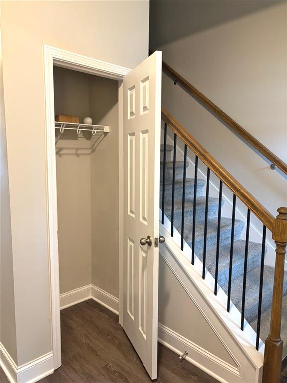 392 Katie Lane Commerce, GA 30529 - Photo 5 of 58 a view of a hallway with wooden floor and staircase
