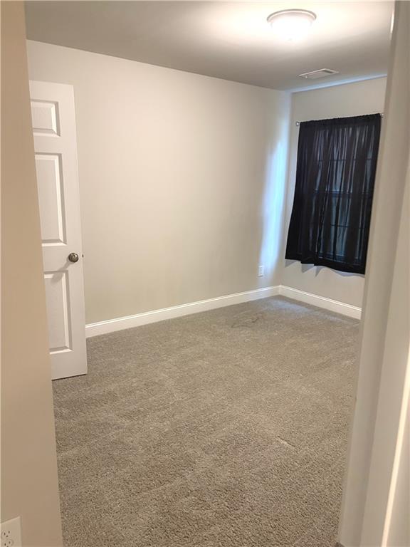 392 Katie Lane Commerce, GA 30529 - Photo 55 of 58 an empty room with windows