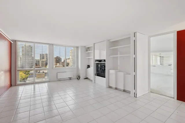 a bathroom with a granite countertop sink a toilet and a mirror