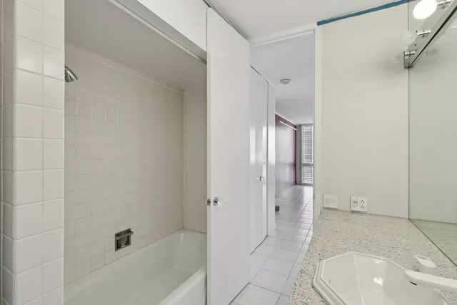 a view of empty room with white walls