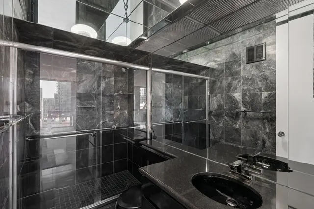 a view of a patio with table and chairs