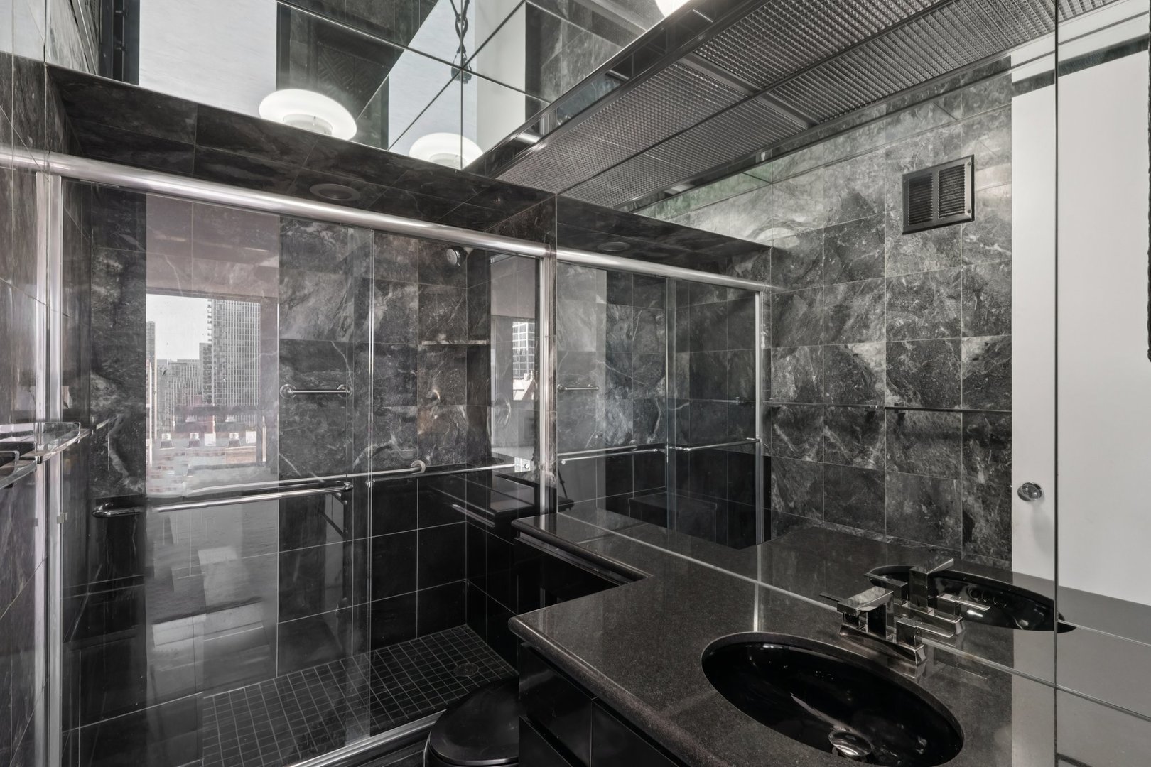 1240 North Lake Shore Drive, Unit 14A Chicago, IL 60610 - Photo 21 of 43 a bathroom with a sink and a mirror