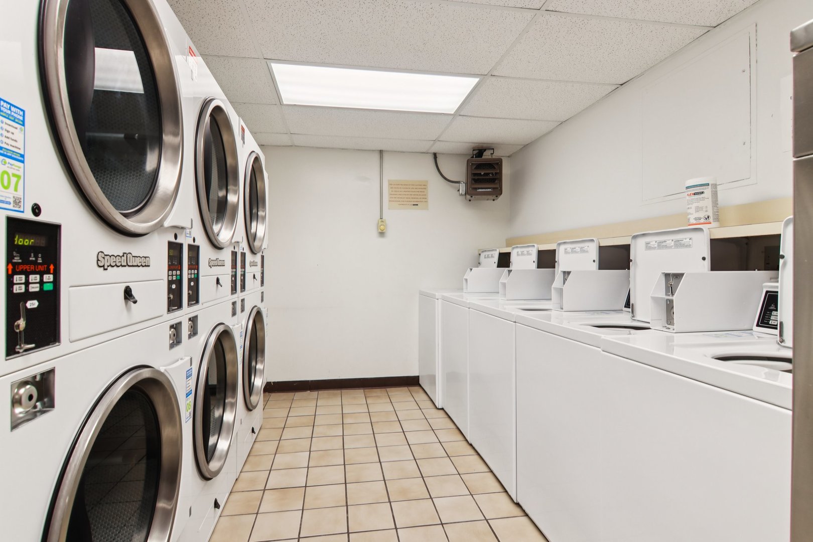 1240 North Lake Shore Drive, Unit 14A Chicago, IL 60610 - Photo 29 of 43 a utility room with dryer and washer