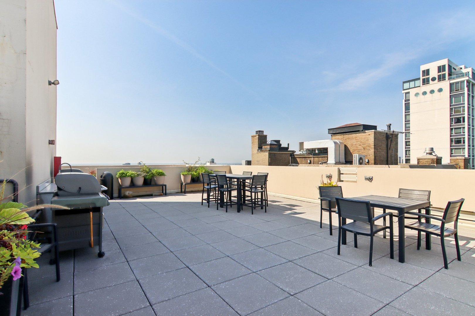 1240 North Lake Shore Drive, Unit 14A Chicago, IL 60610 - Photo 36 of 43 a view of a dining room with furniture and a potted plant
