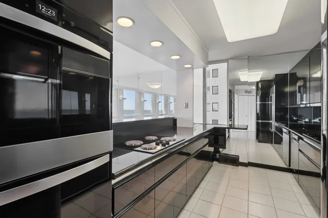 a lobby with furniture and view of living room