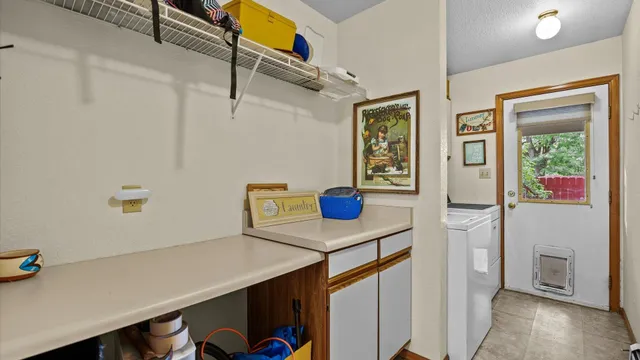 a view of a storage and utility room with a window